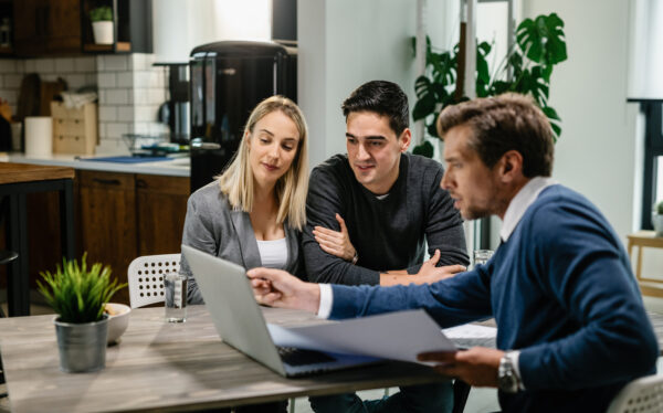 A financial planning trusted advisor discussing Smart Financial Planning with a couple.