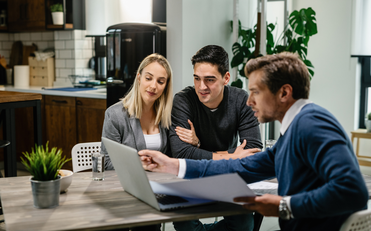 A financial planning trusted advisor discussing Smart Financial Planning with a couple.
