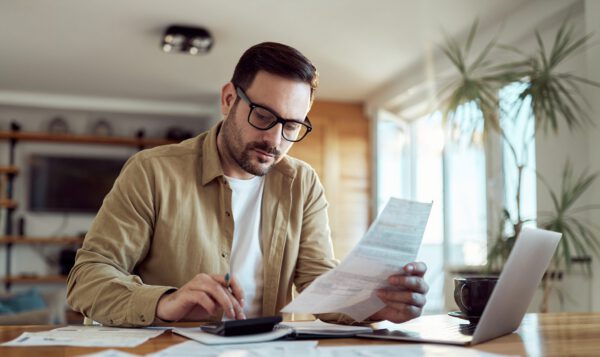 Business owner working on his accounting and financial statements.