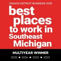 A red and black badge reads: Crains Detroit Business 2025 best places to work in Southeast Michigan. Below, on a black bar: Multiyear Winner 2025 ★ 2024 ★ 2023 ★ 2022.